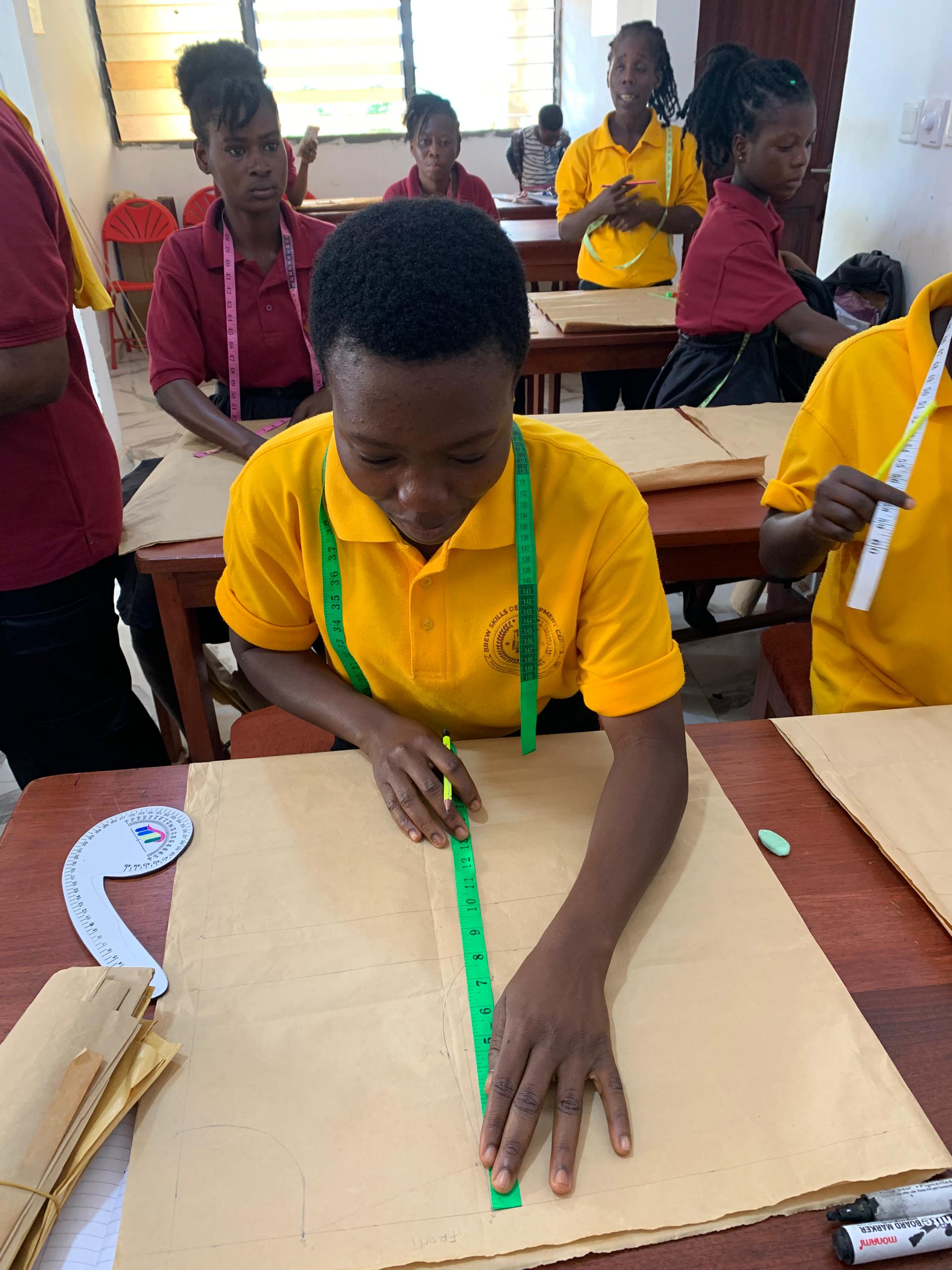 Students in a BSDC garment-making classroom